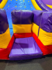 COMMERCIAL INFLATABLE SLIPPERY SLOPE SLIDE WITH PADDED ENTRY, HIGH SIDEWALLS, AND ENCLOSED LANDING AREA. UNIT FEATURES MULTI-COLOR VINYL CONSTRUCTION WITH TOP SAFETY NETTING. - 6