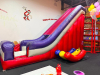 COMMERCIAL INFLATABLE 18 FT SLIDE WITH BLOWER AND ROUND MULTI-LEVEL CLIMBING PLAY STRUCTURE. INCLUDES INFLATABLE SLIDE, BLOWER FAN, METAL FRAME PLAY TOWER, NETTING, AND PADDED SUPPORTS. DISASSEMBLY REQUIRED.