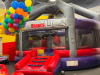 LARGE COMMERCIAL &ldquo;WRECKING BALL&rdquo; INTERACTIVE INFLATABLE GAME BY INFLATABLE 2000 / BOUNCE U. PLAYERS STAND ON PEDESTALS WHILE SWINGING THE CENTER WRECKING BALL TO KNOCK OPPONENTS OFF BALANCE.