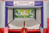 INFLATABLE TEE BALL GAME BY &ldquo;BOUNCE U.&rdquo; FEATURES BASEBALL-THEMED TARGET BACKDROP WITH TEE BALL HITTING AREA AND ENCLOSED PLAY SPACE. UNIT COMES WITH BLOWER/FAN AND IS CURRENTLY ROLLED UP AND READY FOR PICKUP. - 2
