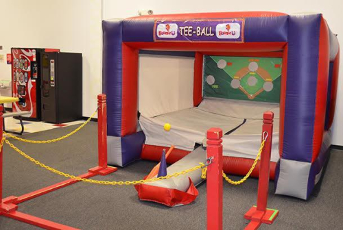 INFLATABLE TEE BALL GAME BY &ldquo;BOUNCE U.&rdquo; FEATURES BASEBALL-THEMED TARGET BACKDROP WITH TEE BALL HITTING AREA AND ENCLOSED PLAY SPACE. UNIT COMES WITH BLOWER/FAN AND IS CURRENTLY ROLLED UP AND READY FOR PICKUP.