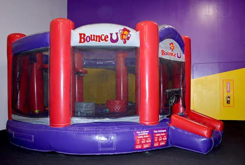LARGE INFLATABLE JOUSTING ARENA/BOUNCE UNIT BRANDED &ldquo;BOUNCE U.&rdquo; UNIT IS CURRENTLY ROLLED UP FOR STORAGE AND INCLUDES BLOWER/FAN. FEATURES HEAVY-DUTY VINYL CONSTRUCTION WITH ENCLOSED SIDES AND INFLATABLE ENTRY RAMP.