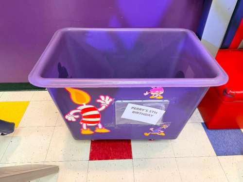 PURPLE PLASTIC HOPPER ON CASTERS.