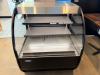 FEDERAL CURVED GLASS REFRIGERATED DISPLAY CASE WITH BLACK FINISH, THREE TIER INTERIOR SHELVING, TEMPERED GLASS SIDES, AND STAINLESS STEEL TOP. - 4