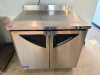 TURBO AIR TWO DOOR UNDERCOUNTER REFRIGERATOR WITH STAINLESS STEEL TOP, DIGITAL TEMPERATURE DISPLAY, AND STAINLESS STEEL CABINET CONSTRUCTION.