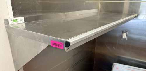 48" X 16" STAINLESS WALL SHELF.