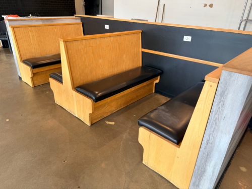 (2) SECTIONS OF 50" WOODEN BOOTH SEATING W/ BLACK PADDED SEAT CUSHIONS.