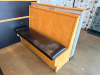 (2) SECTIONS OF 50" WOODEN BOOTH SEATING W/ BLACK PADDED SEAT CUSHIONS. - 3
