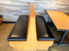 (2) SECTIONS OF 50" WOODEN BOOTH SEATING W/ BLACK PADDED SEAT CUSHIONS. - 2