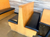 (2) SECTIONS OF 50" WOODEN BOOTH SEATING W/ BLACK PADDED SEAT CUSHIONS. - 3