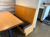 (2) SECTIONS OF 50" WOODEN BOOTH SEATING W/ BLACK PADDED SEAT CUSHIONS. - 4