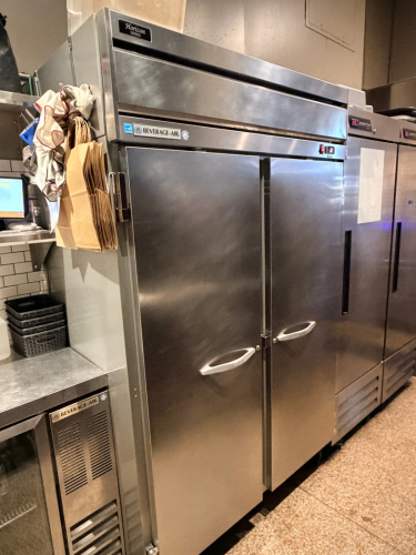 BEVERAGE-AIR TWO-SECTION REACH-IN REFRIGERATOR WITH FULL HEIGHT SWING DOORS, DIGITAL TEMPERATURE DISPLAY, AND INTERNAL WIRE SHELVING.