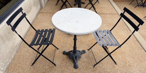 24" ROUND WHITE MARBLE TOP BISTRO TABLE WITH TWO METAL CHAIRS AND HEAVY DUTY CAST IRON CLAW FOOT BASE.
