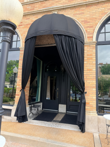 BLACK FABRIC CUSTOM COMMERCIAL ENTRANCE CANOPY WITH DRAPED OUTDOOR CURTAINS