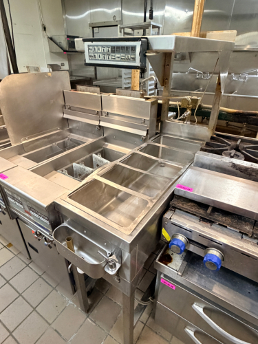 STAINLESSDUMP STATION W/ OVER HEAD HEAT LAMP AND SECTIONED DROP IN FOR INSERTS.