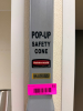 (2) WALL MOUNTED POP UP SAFETY CONES W/ RACKS.