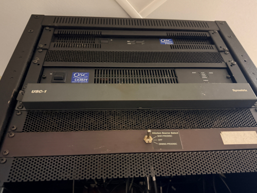 WALL MOUNTED ELECTRONICS CABINET W/ CONTENTS.