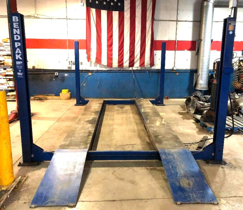 BEND PAK 12,000 LB. CAPACITY FOUR POST AUTO LIFT. (TAKEN DOWN AND READY FOR PICK UP)