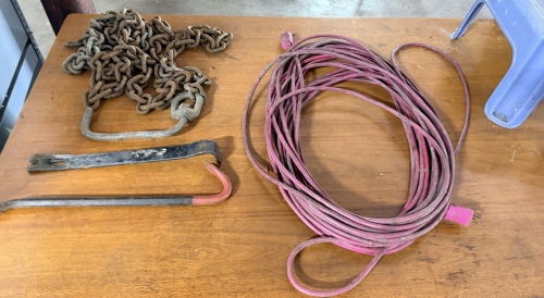 CONTENTS OF DESK - EXTENSION CORD, CHAIN, CROW BARS, AND STOOL
