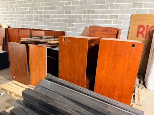LARGE LOT OF BROKE OR DAMAGED OFFICE DESKS AND FURNISHINGS.