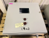 HOFFMAN ELECTRICAL CONTROL PANEL ENCLOSURE WITH PRE-WIRED TERMINAL BLOCKS, DIN RAIL COMPONENTS, STATUS INDICATOR LIGHTS, AND VIEWING WINDOW. STEEL NEMA-TYPE ENCLOSURE WITH LOCKING HANDLE. INTERIOR CONTAINS TERMINAL STRIPS, CIRCUIT PROTECTION COMPONENTS, A