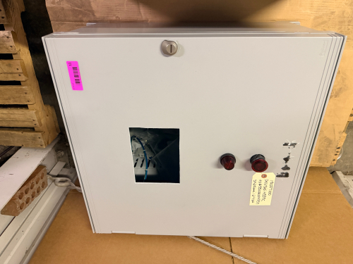 HOFFMAN ELECTRICAL CONTROL PANEL ENCLOSURE WITH PRE-WIRED TERMINAL BLOCKS, DIN RAIL COMPONENTS, STATUS INDICATOR LIGHTS, AND VIEWING WINDOW. STEEL NEMA-TYPE ENCLOSURE WITH LOCKING HANDLE. INTERIOR CONTAINS TERMINAL STRIPS, CIRCUIT PROTECTION COMPONENTS, A