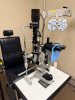 BURTON XL3000 OPHTHALMIC EXAMINATION SYSTEM WITH SLIT LAMP, PHOROPTOR, EXAM TABLE, AND OVERHEAD LIGHTING ASSEMBLY. INCLUDES ARTICULATING INSTRUMENT ARM, CONTROL CONSOLE, BINOCULAR MICROSCOPE, AND PATIENT POSITIONING TABLE - 6