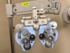 BURTON XL3000 OPHTHALMIC EXAMINATION SYSTEM WITH SLIT LAMP, PHOROPTOR, EXAM TABLE, AND OVERHEAD LIGHTING ASSEMBLY. INCLUDES ARTICULATING INSTRUMENT ARM, CONTROL CONSOLE, BINOCULAR MICROSCOPE, AND PATIENT POSITIONING TABLE - 8