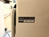 BURTON OPHTHALMIC EXAM CHAIR WITH PADDED VINYL UPHOLSTERY, ADJUSTABLE HEADREST, PADDED ARMRESTS, AND INTEGRATED FOOT PLATFORM. MANUAL RECLINING AND HEIGHT ADJUSTMENT FEATURES WITH METAL BASE CONSTRUCTION. - 3