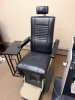 BURTON OPHTHALMIC EXAM CHAIR WITH PADDED VINYL UPHOLSTERY, ADJUSTABLE HEADREST, PADDED ARMRESTS, AND INTEGRATED FOOT PLATFORM. MANUAL RECLINING AND HEIGHT ADJUSTMENT FEATURES WITH METAL BASE CONSTRUCTION. - 4