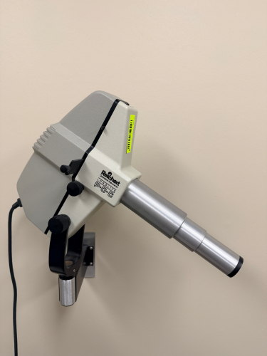 REICHERT LONG LIFE P-O-C WALL MOUNT PROJECTOR WITH EXTENDED OPTICAL TUBE AND ADJUSTABLE MOUNTING BRACKET.