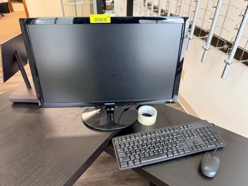 24-INCH LED MONITOR WITH WIDESCREEN DISPLAY, GLOSS BLACK HOUSING, AND DESKTOP STAND. FEATURES HDMI AND VGA INPUTS