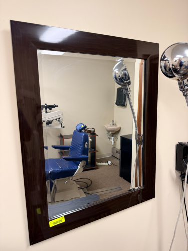 WOODEN FRAMED MIRROR W/ BROWNFINISH.