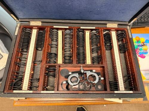 PARTIAL OPTICAL TRIAL LENS SETS IN WOODEN STORAGE CASES. SPHERICAL, CYLINDRICAL, PRISM, AND ACCESSORY LENSES