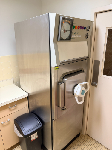 LARGE FLOOR MODEL MEDICAL / DENTAL AUTOCLAVE STERILIZER UNIT WITH STAINLESS STEEL CHAMBER, ANALOG CHART RECORDER, PRESSURE GAUGES, AND MULTI-CYCLE CONTROL PANEL.