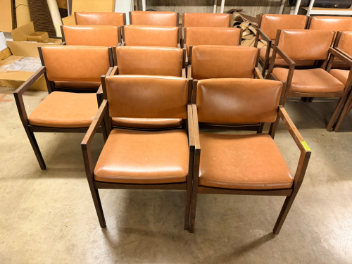 (11) WOODEN AND BROWN VINYL ARM CHAIRS.