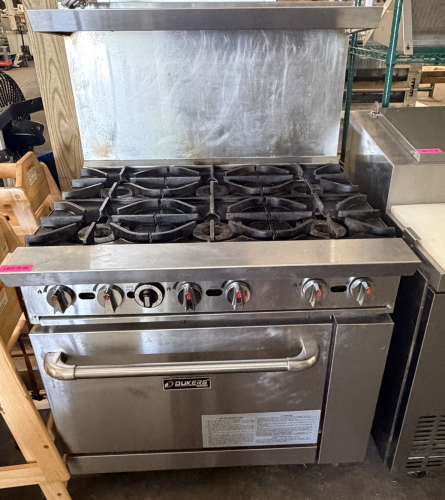 DUKERS SIX BURNER GAS RANGE W/ LOWER OVEN.