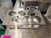 BELSHAW ADAMATIC DONUT ROBOT MARK II AUTOMATIC DONUT FRYER WITH ACCESSORIES. STAINLESS STEEL CONSTRUCTION WITH CONVEYOR FRYING SYSTEM, INCLUDES DEPOSITOR HEAD, HOPPER, PRODUCT TRAY, AND ADDITIONAL ACCESSORY - 7
