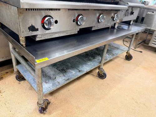 72" X 30" LOW BOY STAINLESS EQUIPMENT STAND. ( ON CASTERS )