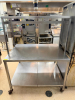48" X 36" HEAVY DUTY STAINLESS TABLE W/ RISER SHELF.