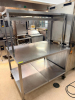 48" X 36" HEAVY DUTY STAINLESS TABLE W/ RISER SHELF. - 2