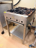 FOUR BURNER GAS RANGE W/ STAINLESS STAND.