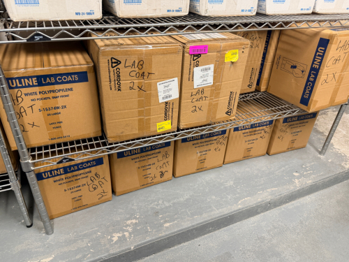 (10) ASSORTED CASES OF FOOD GRADE LAB COATS.