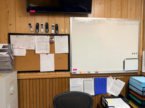 CORK BOARD AND DRY ERASE BOARD.