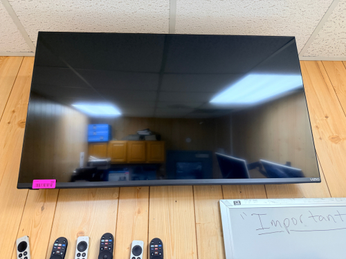 VIZIO 65" FLAT SCREEN TV W/ WALL MOUNT.
