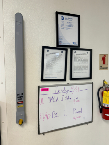 WALL MOUNTED POP UP WET FLOOR SIGN, DRY ERASE BOARD, AND (3) PICTURE FRAMED.