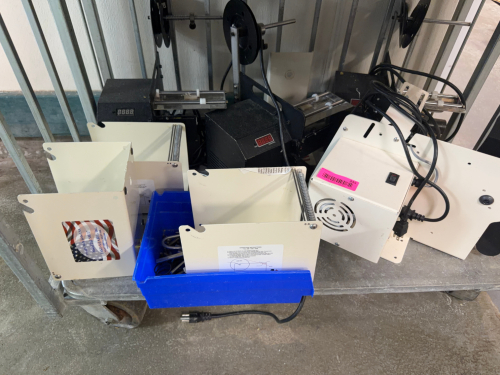 (2) PARTIAL ELECTRIC LABEL APPLICATOR/DISPENSER MACHINE WITH ADJUSTABLE SENSOR ASSEMBLY, LABEL REEL HOLDERS, AND METAL FRAME