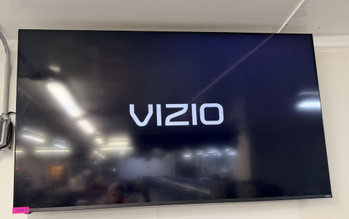 VIZIO 65" FLAT SCREEN TV W/ WALL MOUNT.