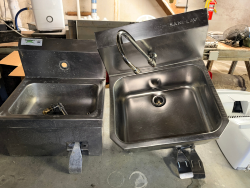 (2) STAINLESS WALL MOUNT HAND SINKS WITH KNEE PADDLES.