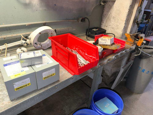 CONTENTS OF TABLE - ASSORTED HARDWARE, PARTS, AND TOOLING.